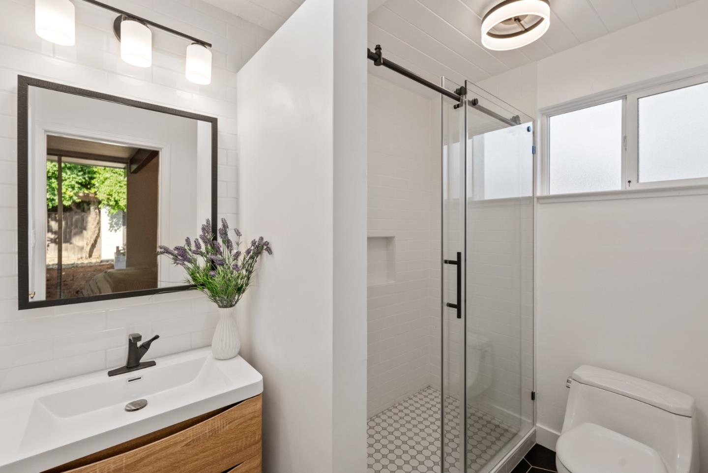 1420 Mallard Way Sunnyvale, CA 94087 - Photo 30 of 48 a bathroom with a sink a toilet and shower