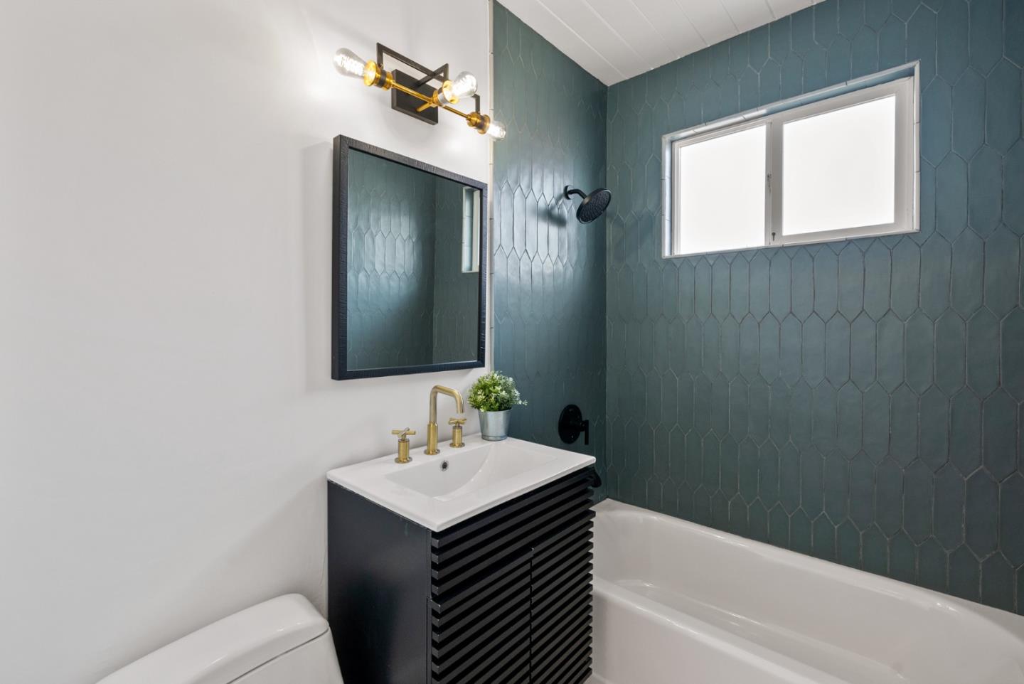 1420 Mallard Way Sunnyvale, CA 94087 - Photo 34 of 48 a bathroom with a sink toilet and tub