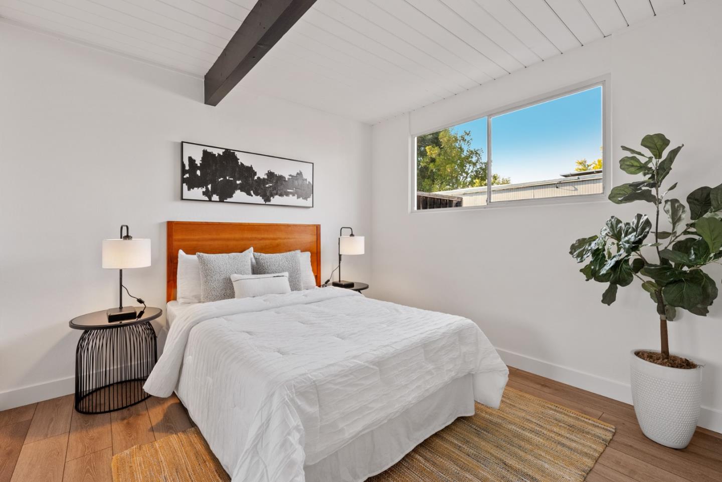 1420 Mallard Way Sunnyvale, CA 94087 - Photo 38 of 48 a bedroom with a bed and a potted plant