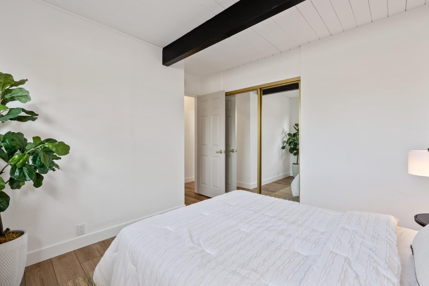 1420 Mallard Way Sunnyvale, CA 94087 - Photo 39 of 48 a bedroom with a bed and a potted plant