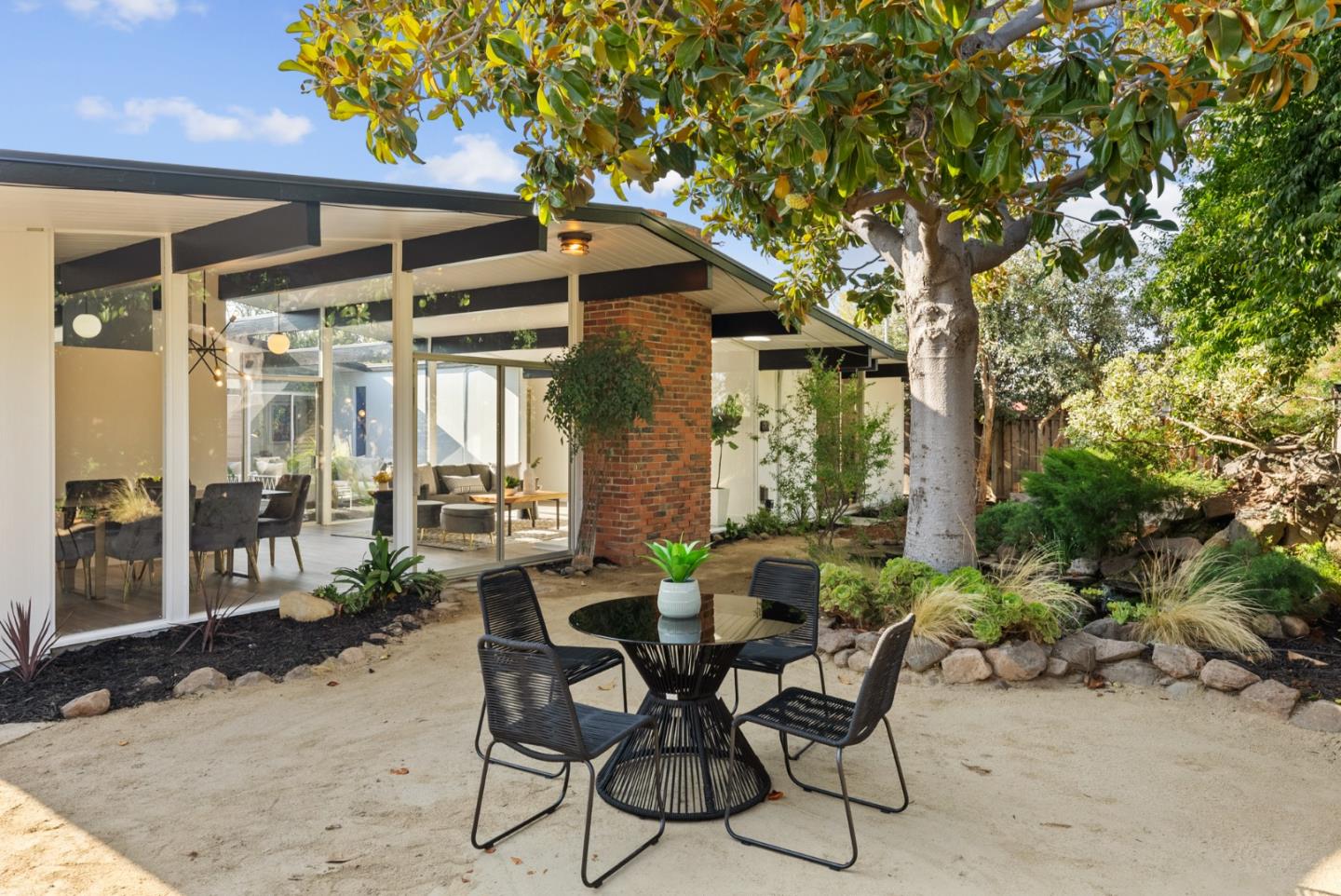 1420 Mallard Way Sunnyvale, CA 94087 - Photo 41 of 48 a view of a patio with table and chairs and potted plants