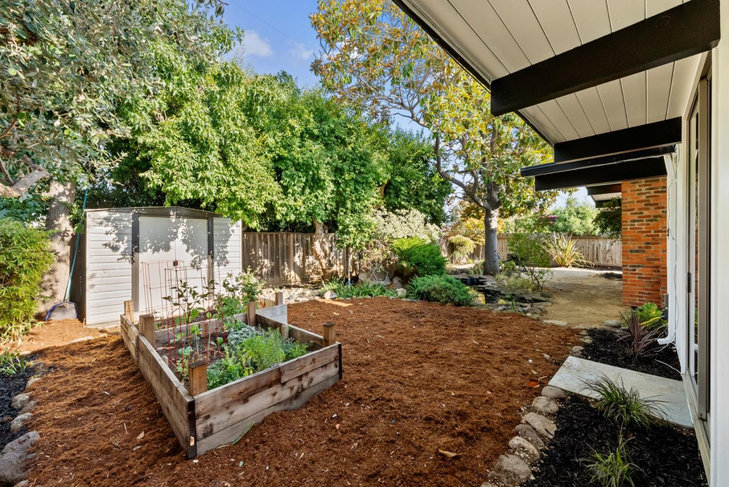 1420 Mallard Way Sunnyvale, CA 94087 - Photo 45 of 48 a view of a bench in back yard of a house