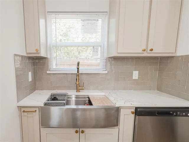 a kitchen with a stove and a sink