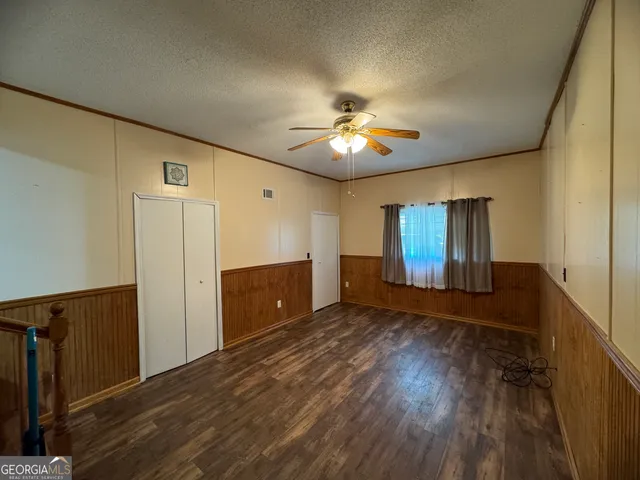 a view of hallway with wooden floor