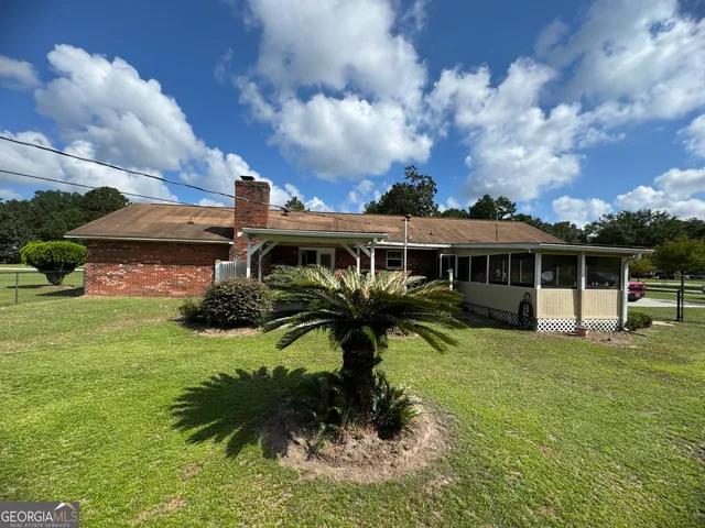 a view of garage with wooden walls