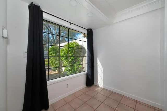 a view of an empty room with windows