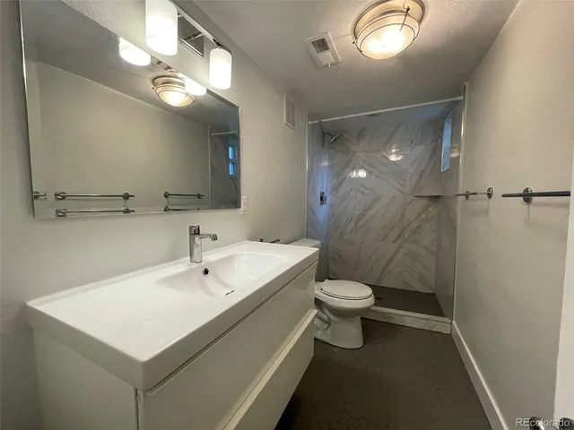 a bathroom with a sink and mirror
