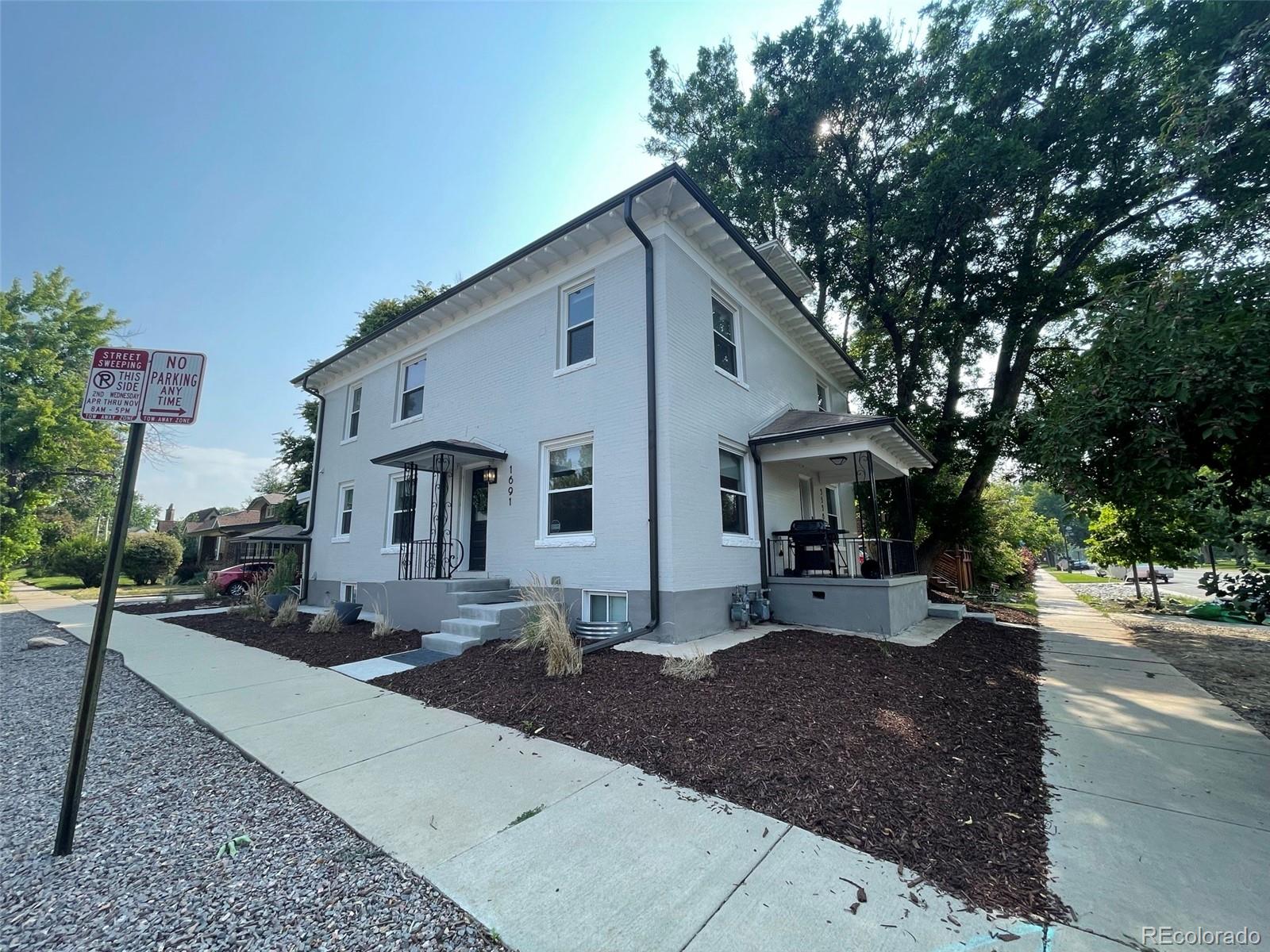 1691 Monroe Street Denver, CO 80206 - Photo 19 of 31 a house view with a outdoor space