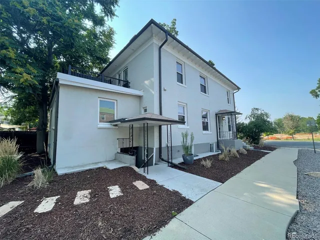 a front view of a house with yard