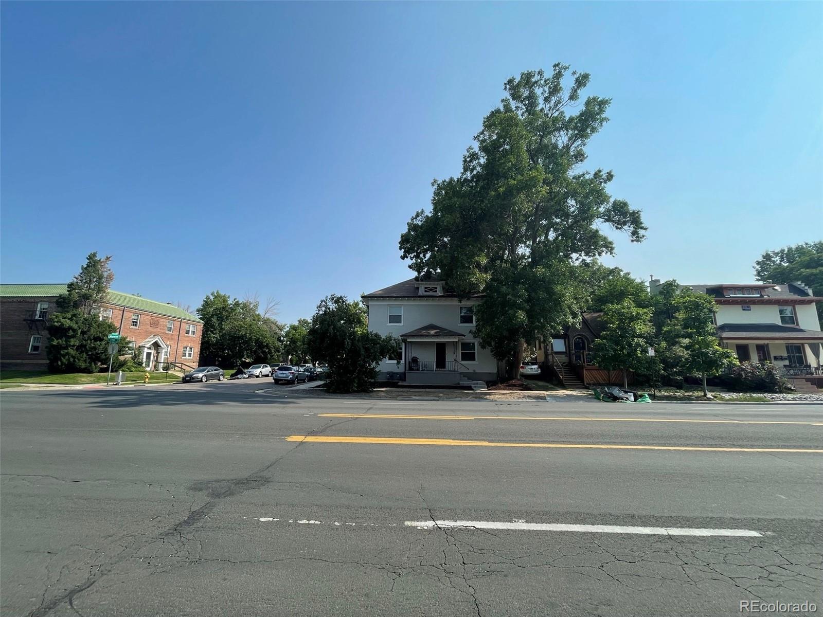 1691 Monroe Street Denver, CO 80206 - Photo 21 of 31 a road view along with trees
