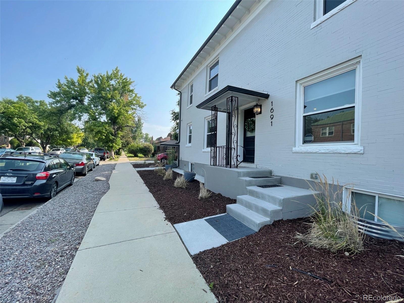 1691 Monroe Street Denver, CO 80206 - Photo 23 of 31 a view of a house with a patio