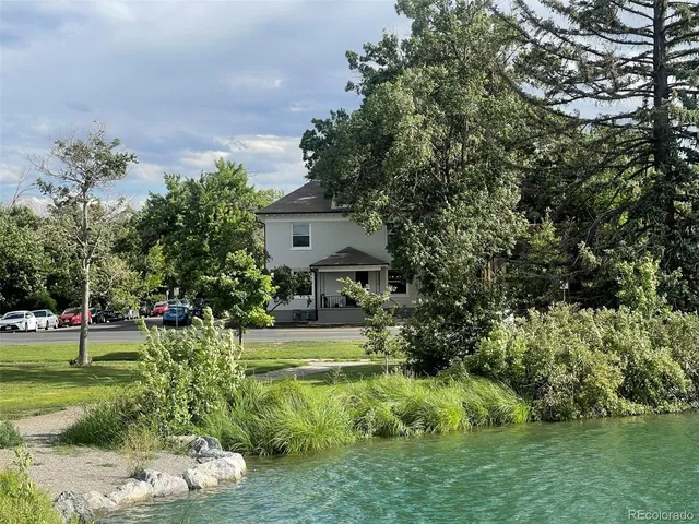 a view of a lake with houses in the back