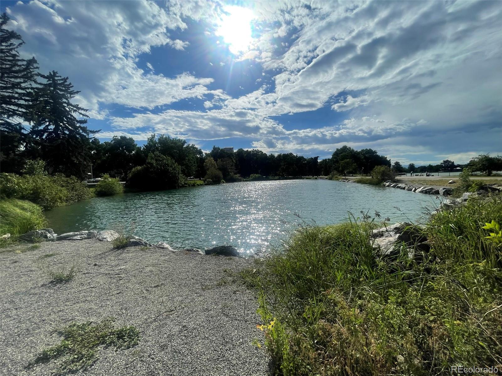 1691 Monroe Street Denver, CO 80206 - Photo 31 of 31 a view of a lake with houses in the back