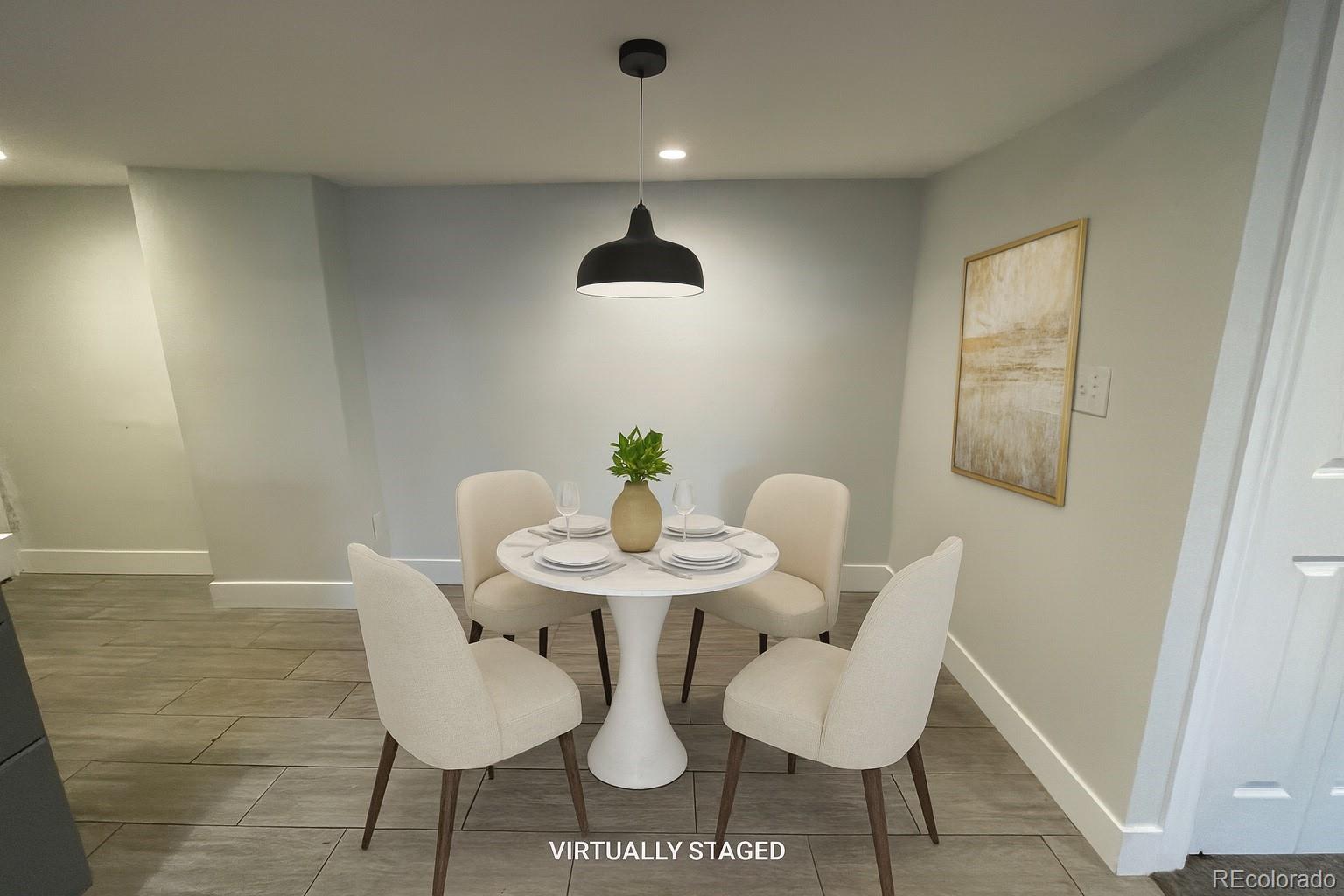 1691 Monroe Street Denver, CO 80206 - Photo 4 of 31 a view of a dining room with furniture and wooden floor