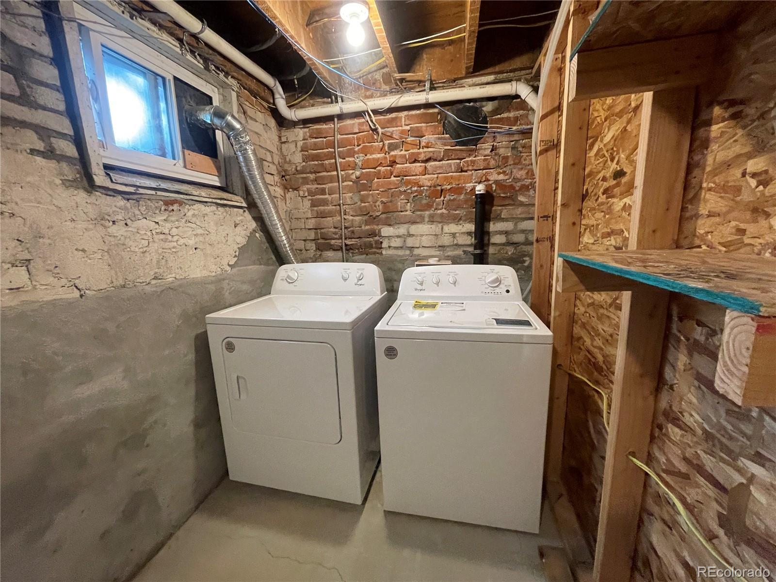 1691 Monroe Street Denver, CO 80206 - Photo 8 of 31 a utility room with dryer and washer