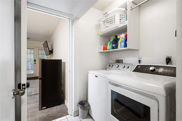 a kitchen with a sink cabinets and window