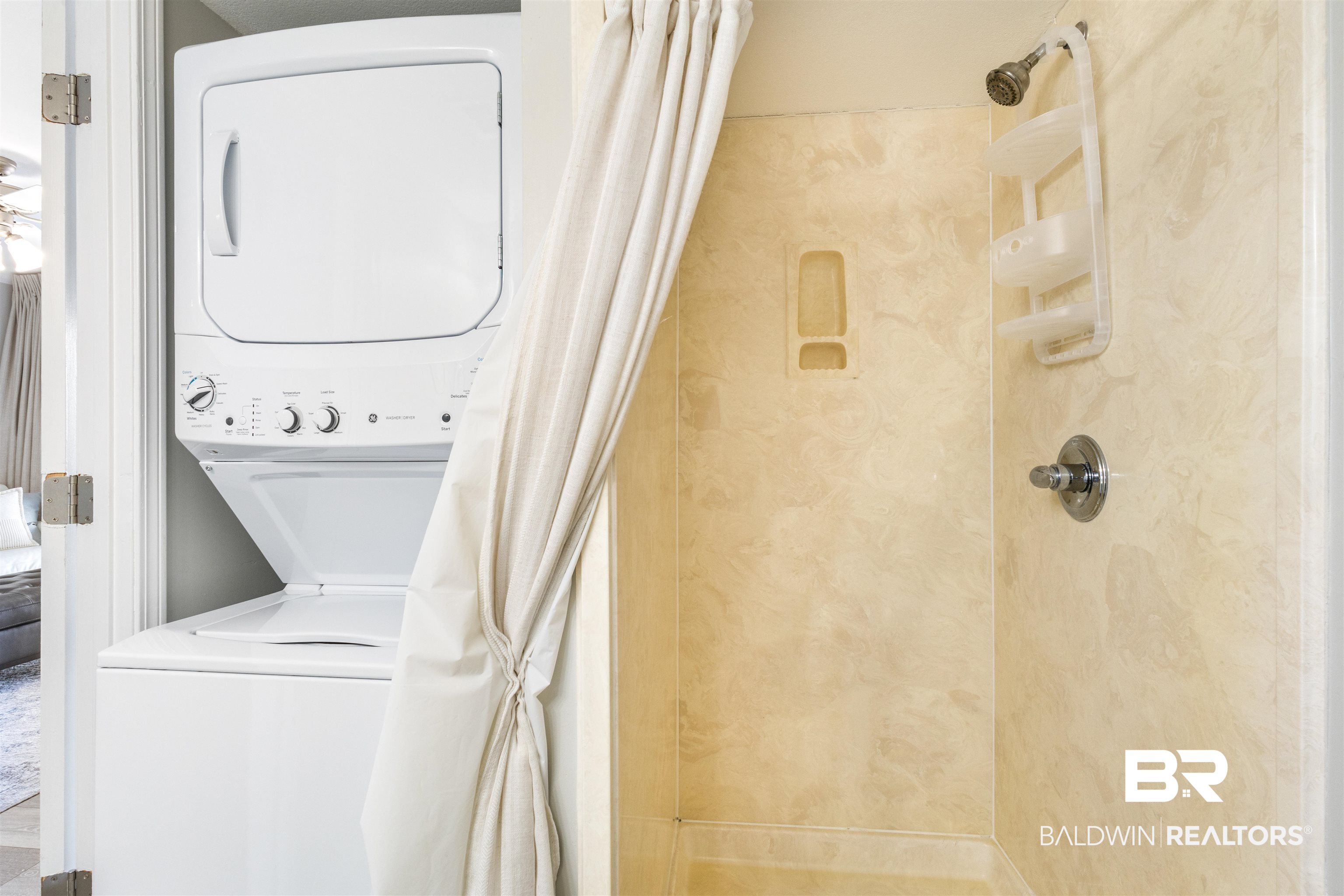 25861 Canal Road, Unit 3 Orange Beach, AL 36561 - Photo 19 of 40 Laundry area featuring stacked washer and clothes dryer