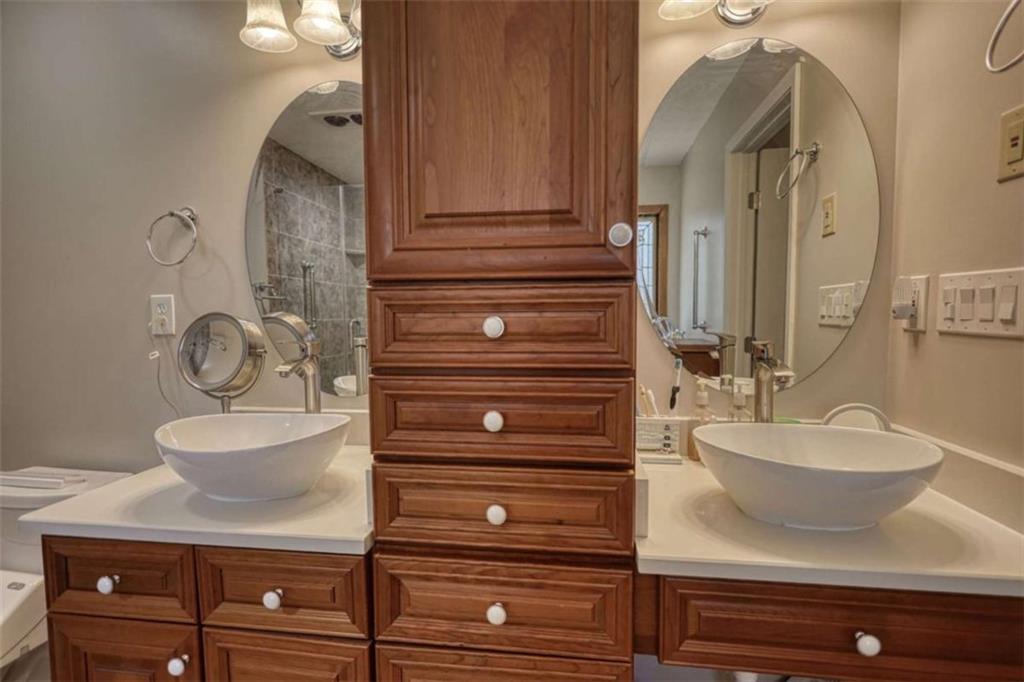 2740 Dennard Road Northeast Conyers, GA 30013 - Photo 25 of 51 a bathroom with a sink and a mirror