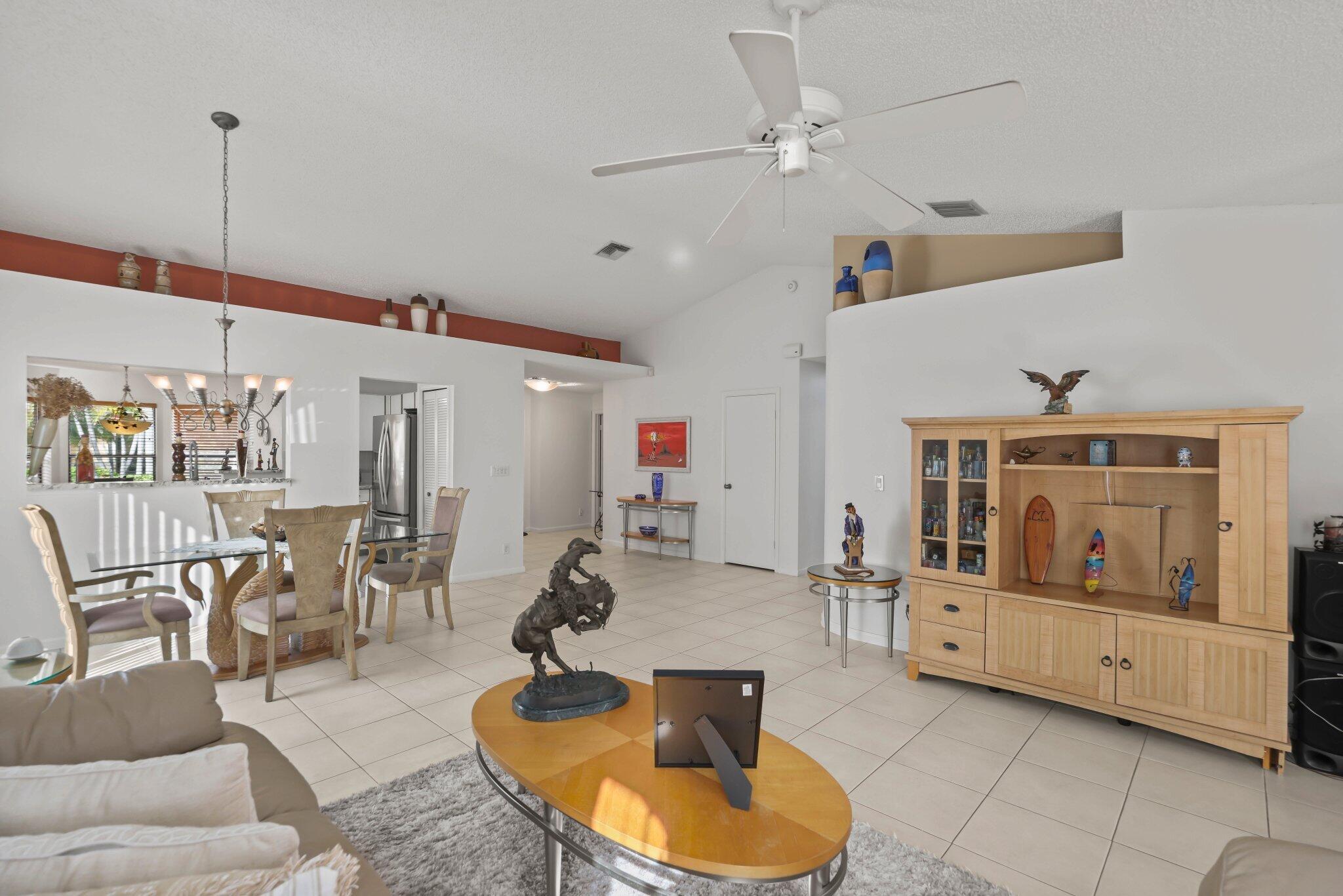 10678 Santa Laguna Drive Boca Raton, FL 33428 - Photo 11 of 40 a living room with furniture and a wooden floor