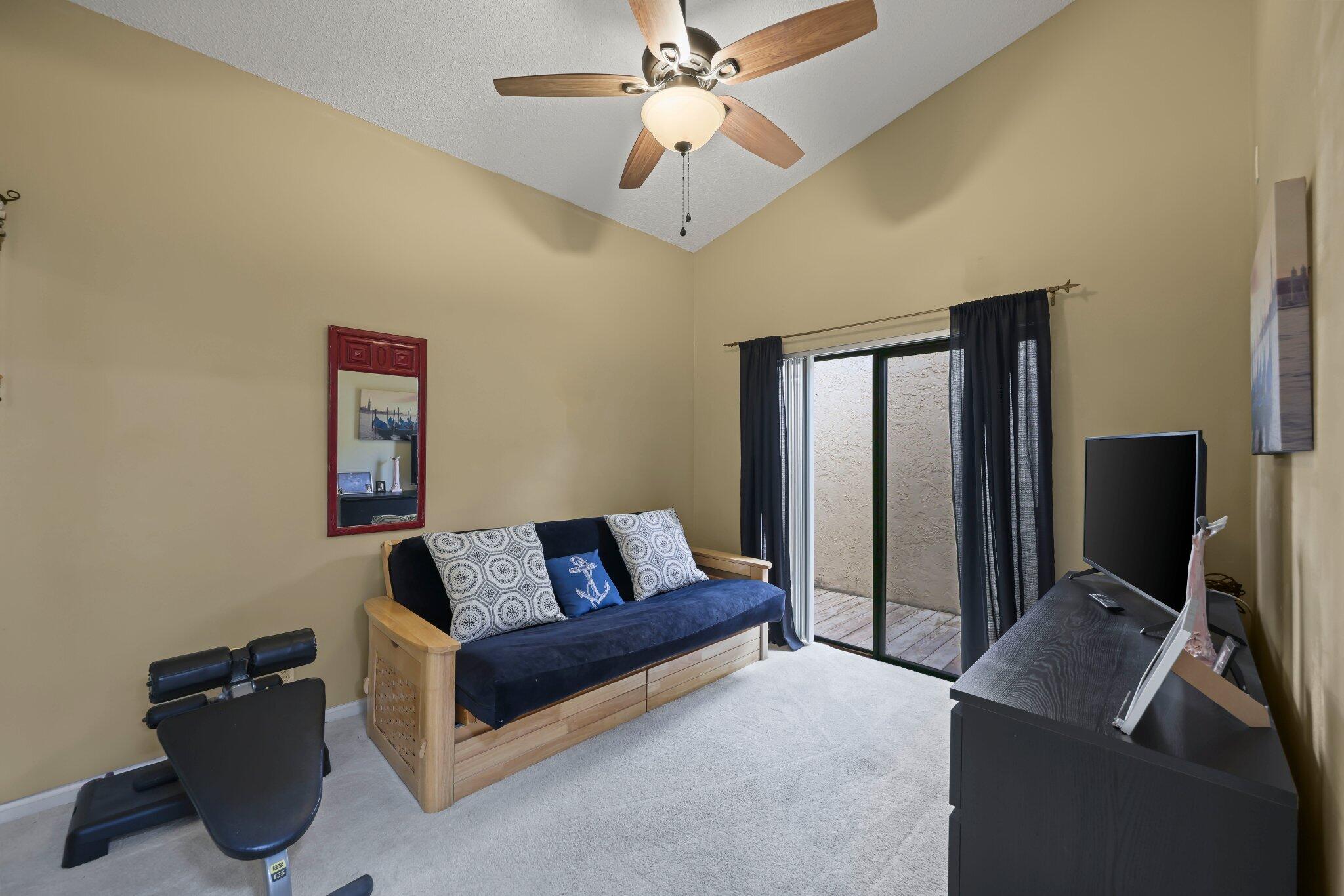 10678 Santa Laguna Drive Boca Raton, FL 33428 - Photo 19 of 40 a living room with furniture and a flat screen tv