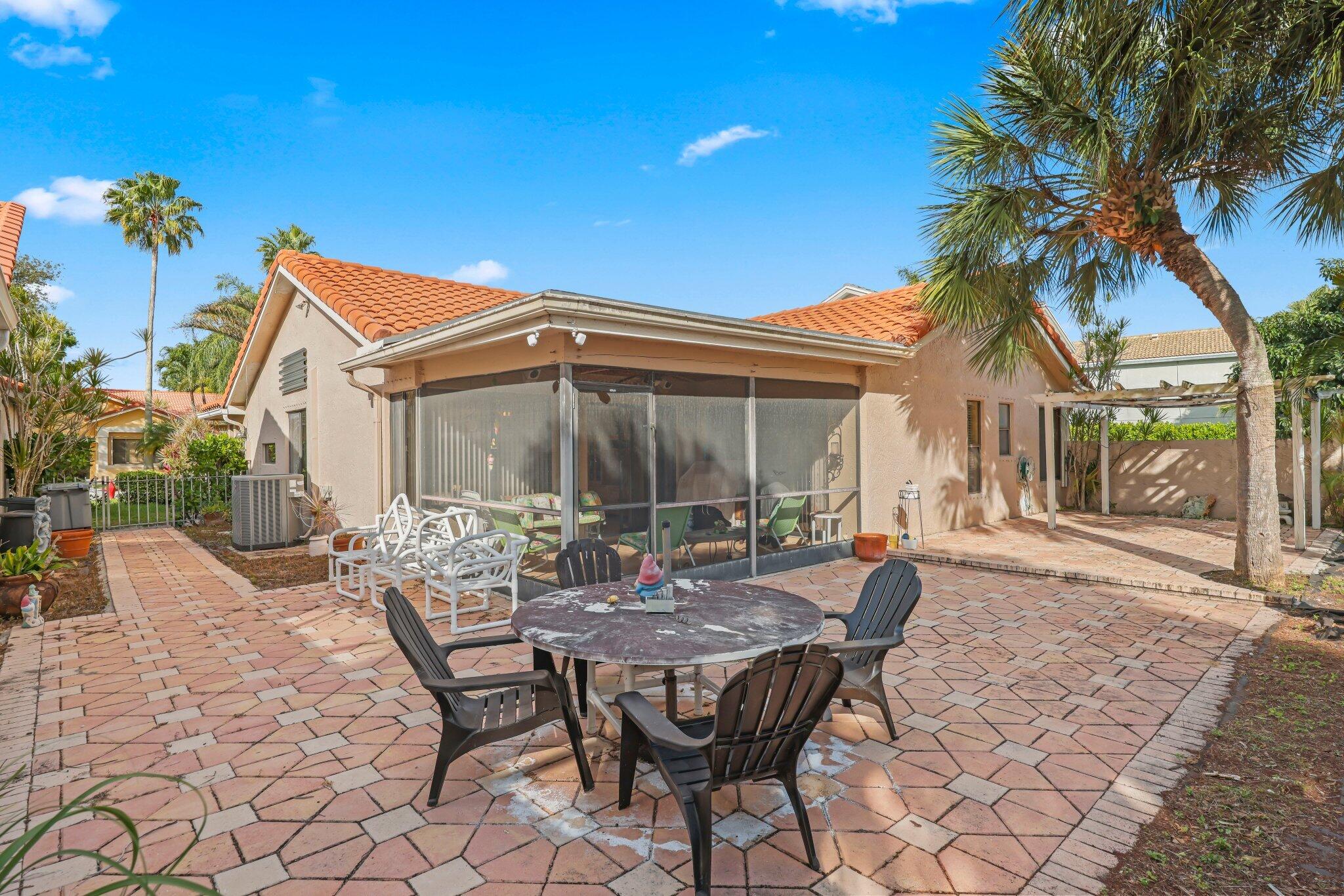 10678 Santa Laguna Drive Boca Raton, FL 33428 - Photo 26 of 40 a view of a house with backyard and sitting area
