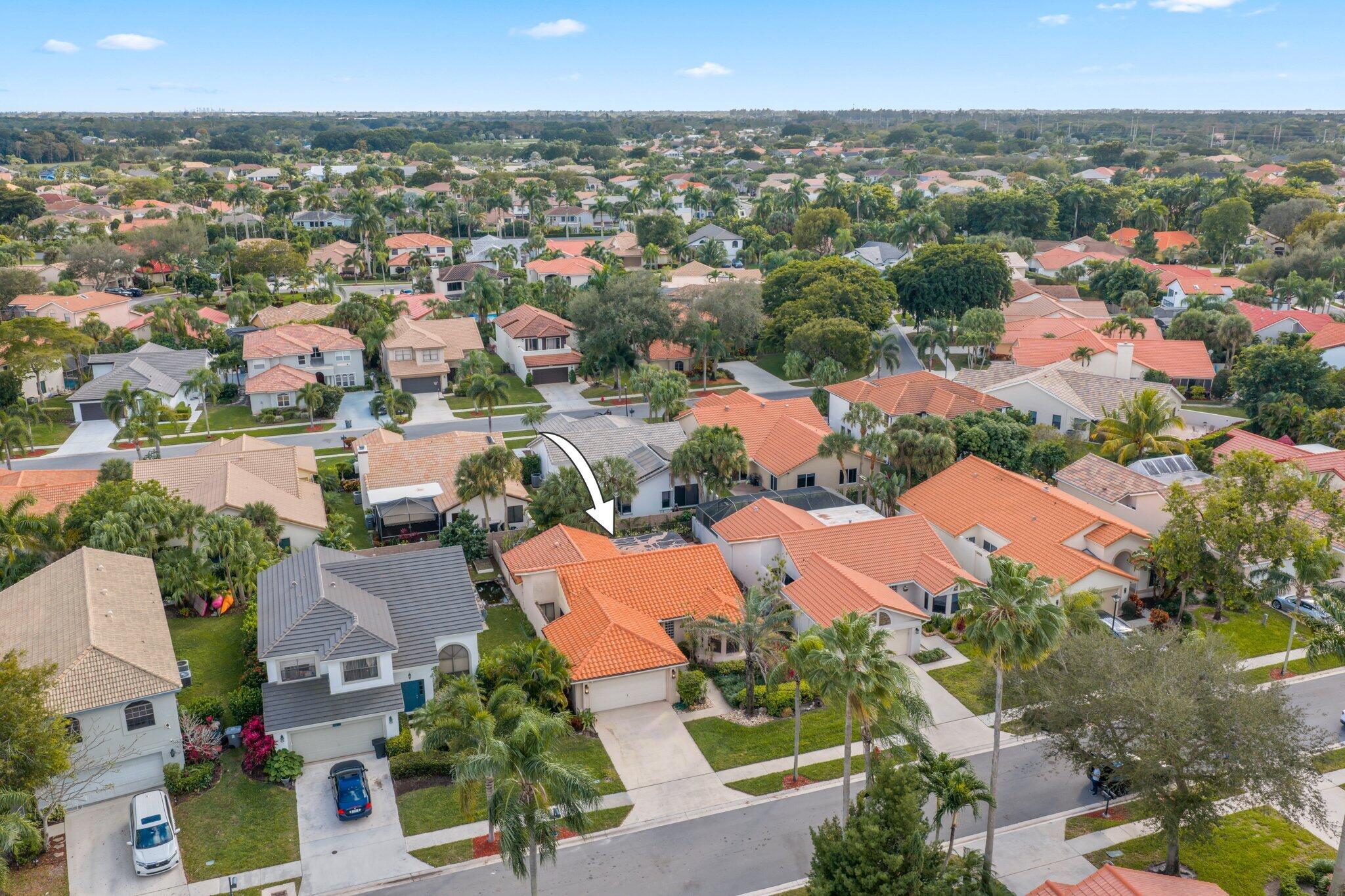 10678 Santa Laguna Drive Boca Raton, FL 33428 - Photo 32 of 40 an aerial view of residential houses with outdoor space