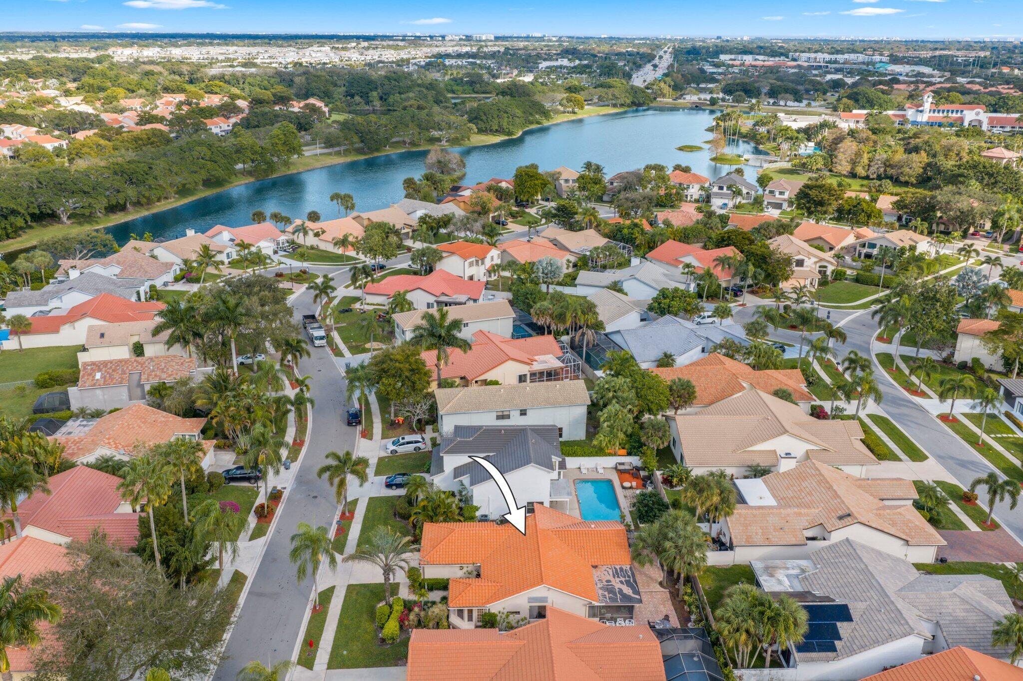10678 Santa Laguna Drive Boca Raton, FL 33428 - Photo 34 of 40 an aerial view of residential houses with outdoor space