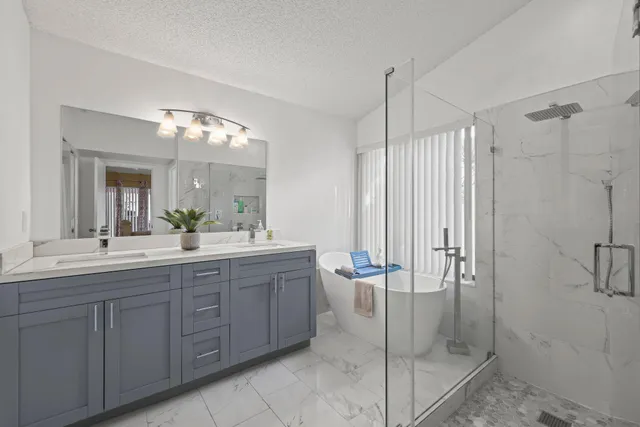 a spacious bathroom with a shower a mirror and a sink