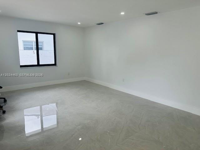 11870 Southwest 5th Street, Unit 1 Miami, FL 33184 - Photo 4 of 38 an empty room with windows