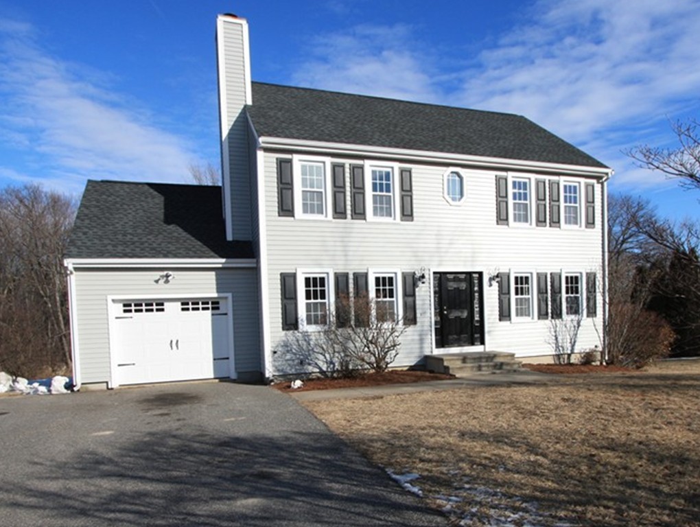 14 Cedar Hill Road Sutton, MA 01590 - Photo 1 of 16 a front view of a house with a yard
