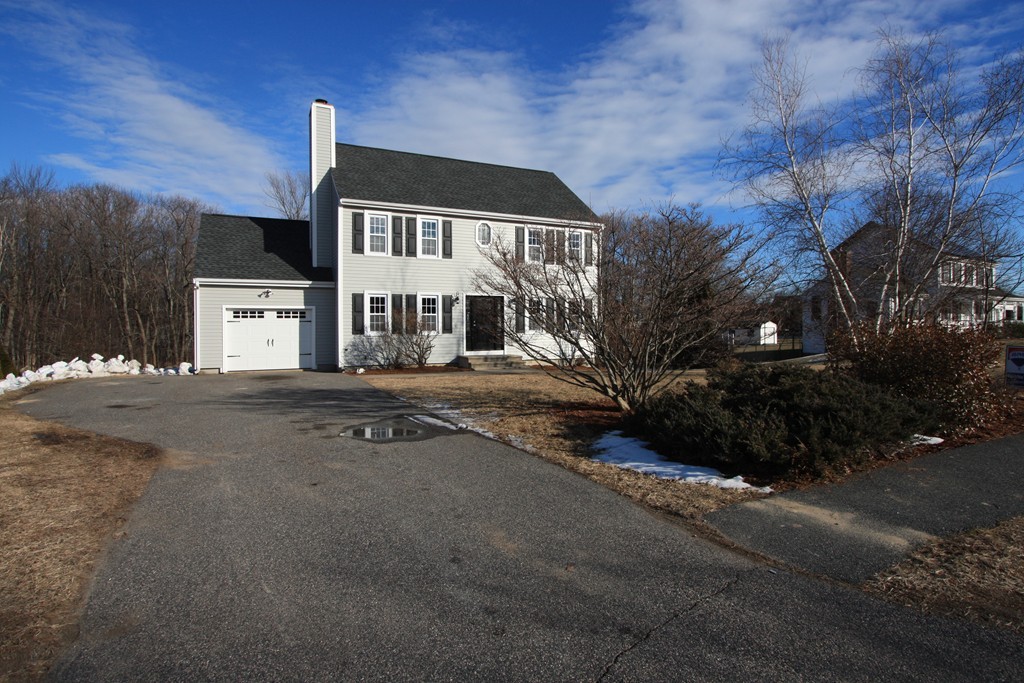 14 Cedar Hill Road Sutton, MA 01590 - Photo 2 of 16 a front view of a house with a yard