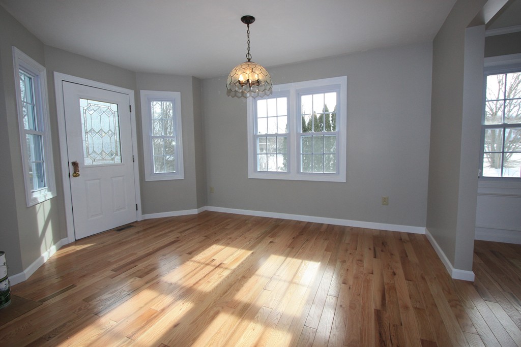 14 Cedar Hill Road Sutton, MA 01590 - Photo 6 of 16 a view of an empty room with wooden floor and a window