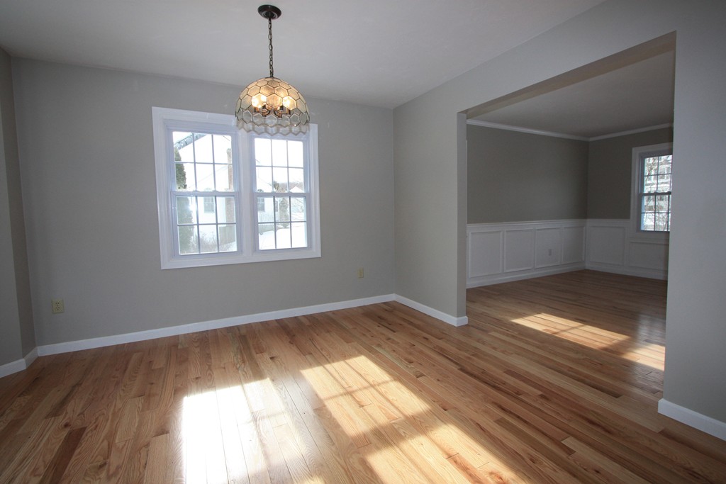 14 Cedar Hill Road Sutton, MA 01590 - Photo 7 of 16 a view of empty room with wooden floor and fan