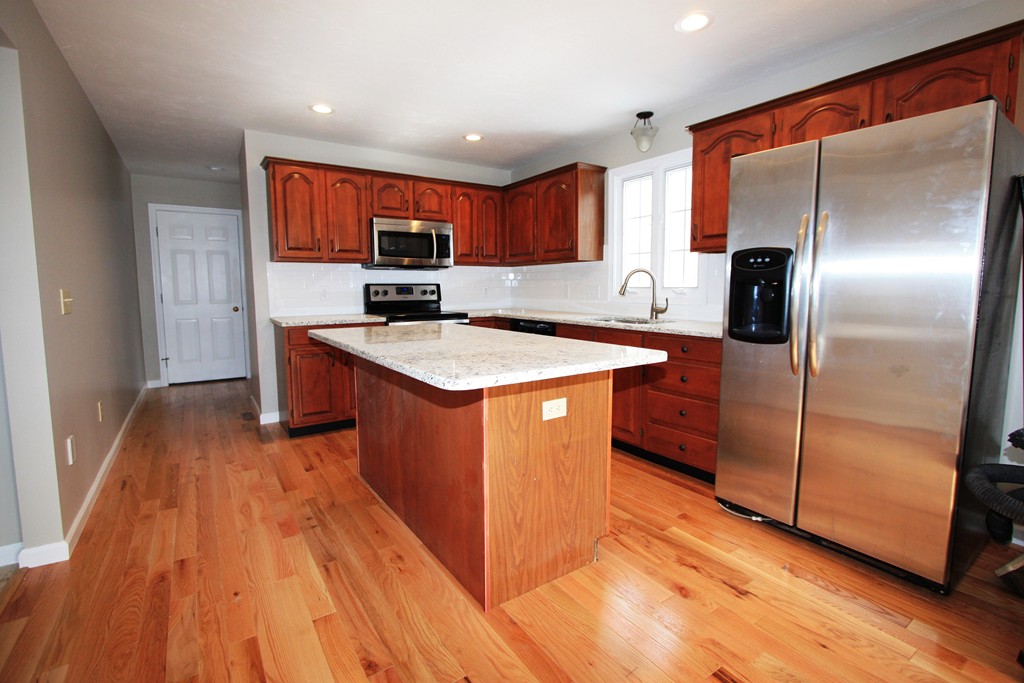 14 Cedar Hill Road Sutton, MA 01590 - Photo 8 of 16 a kitchen with stainless steel appliances granite countertop a refrigerator a sink and a stove
