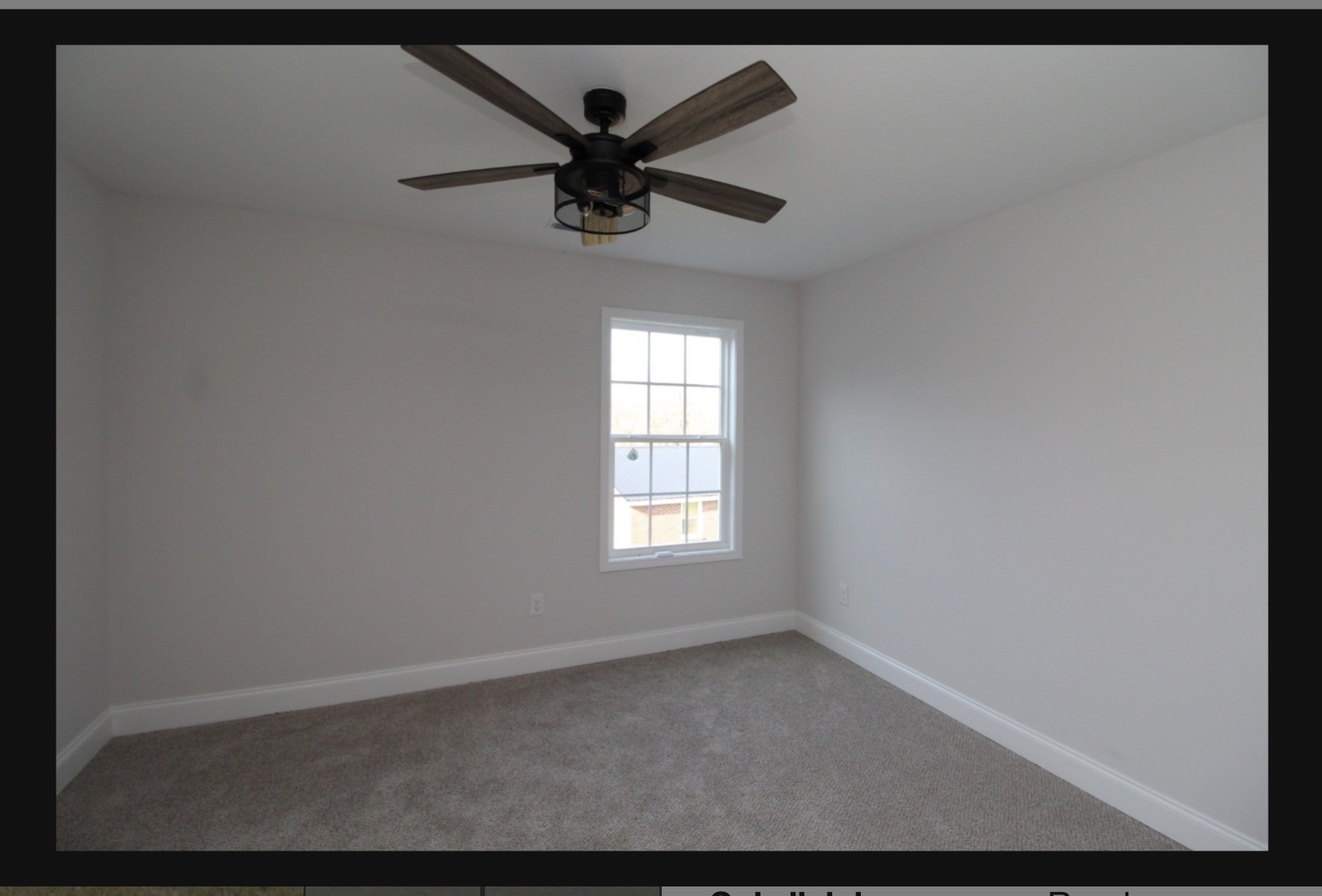574 Russell Street Guthrie, KY 42234 - Photo 12 of 15 a view of a big room with a ceiling fan and windows