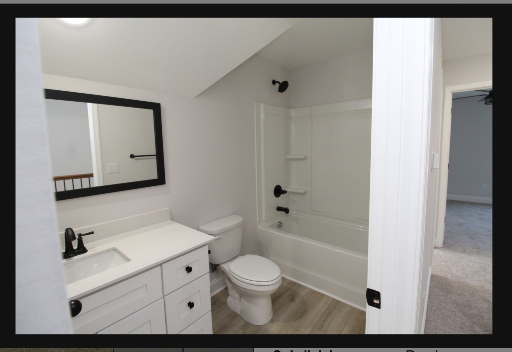 574 Russell Street Guthrie, KY 42234 - Photo 15 of 15 a bathroom with a toilet sink a mirror a bathtub and shower