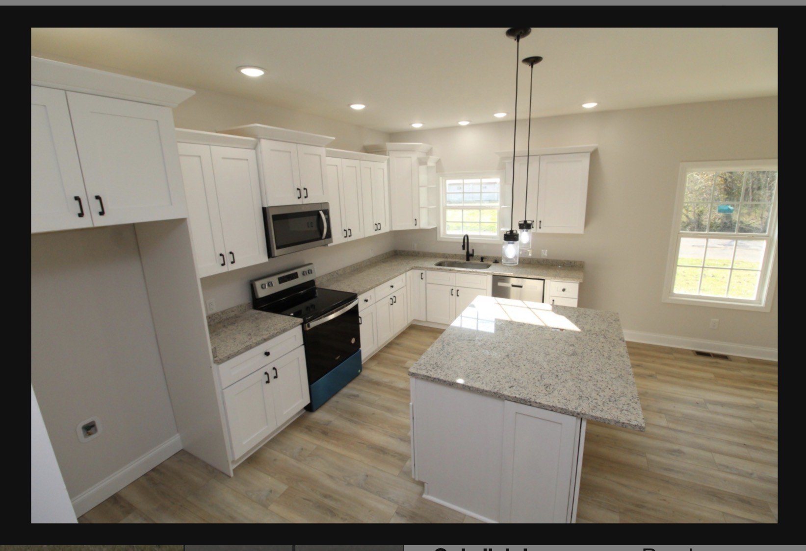 574 Russell Street Guthrie, KY 42234 - Photo 7 of 15 a kitchen with stainless steel appliances granite countertop a stove a sink and a microwave