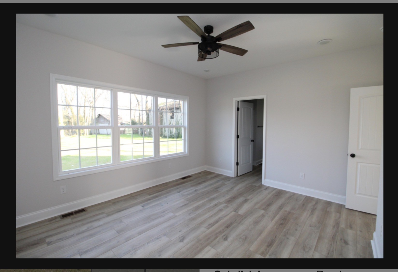 574 Russell Street Guthrie, KY 42234 - Photo 8 of 15 a view of empty room with wooden floor and ceiling fan