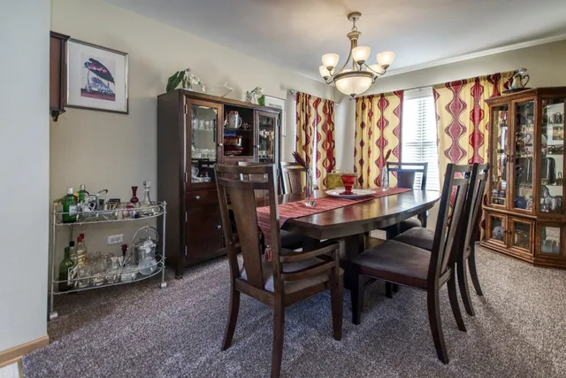 a dining room with furniture and window