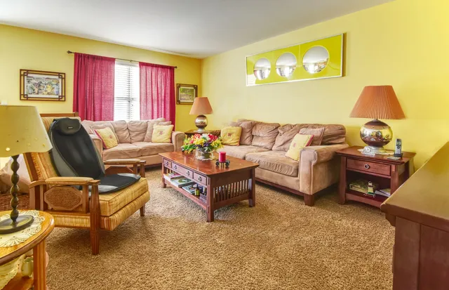 a living room with furniture and a window