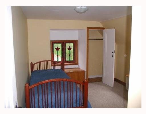 3012 Marshall Road Observatory Hill, PA 15214 - Photo 7 of 11 Other. This bedroom features nice closet space and is highlighted by a stained glass window.