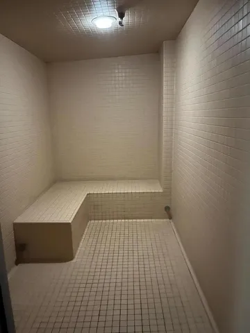 a view of room with stairs and a cabinet