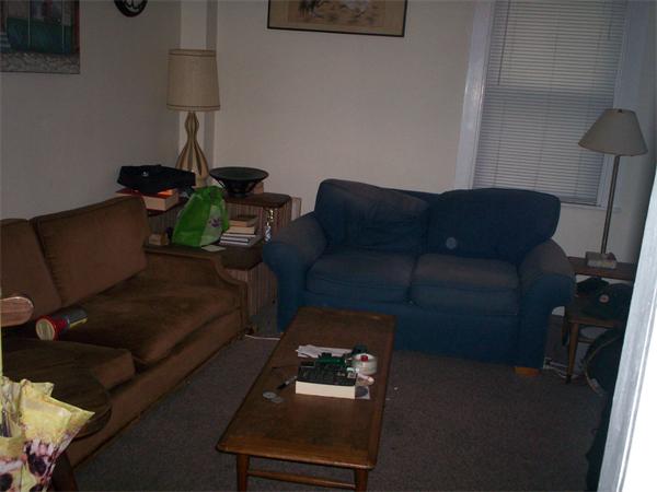 57-59 Myrtle Street Somerville, MA 02145 - Photo 16 of 30 a living room with furniture and a lamp