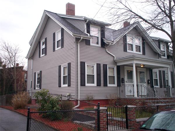 57-59 Myrtle Street Somerville, MA 02145 - Photo 2 of 30 a front view of a house with a yard