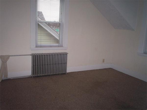 57-59 Myrtle Street Somerville, MA 02145 - Photo 22 of 30 an empty room with windows