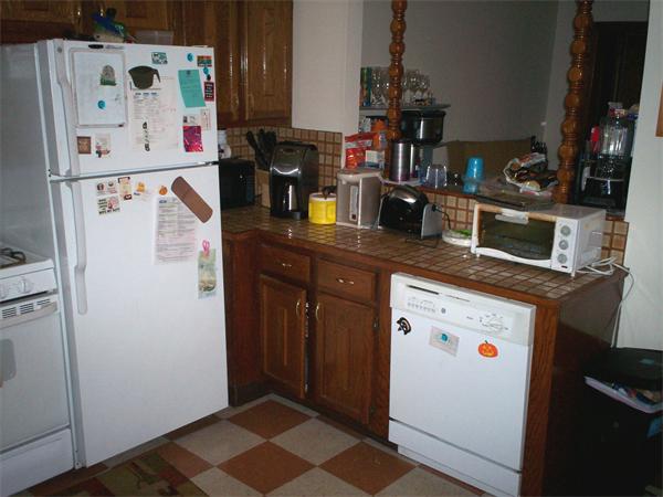 57-59 Myrtle Street Somerville, MA 02145 - Photo 6 of 30 a kitchen with refrigerator and window