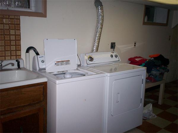 57-59 Myrtle Street Somerville, MA 02145 - Photo 9 of 30 a utility room with dryer and washer
