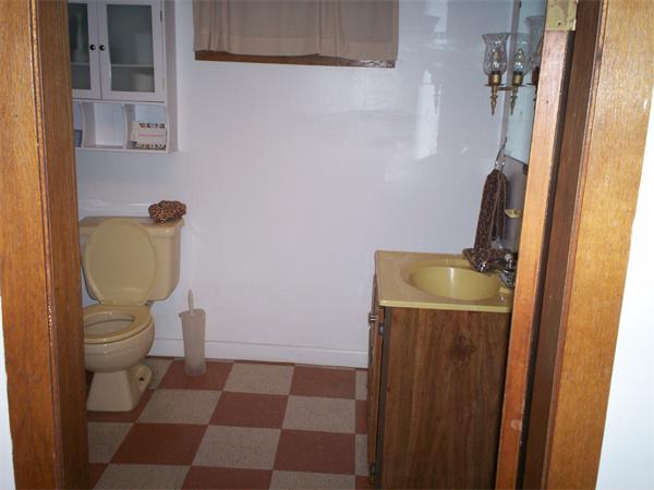 57-59 Myrtle Street Somerville, MA 02145 - Photo 10 of 30 a bathroom with a toilet and a mirror