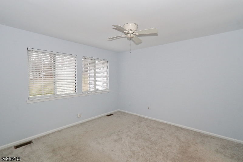 21 Parkside Road Bedminster, NJ 07921 - Photo 15 of 17 a view of a room with a window and a fan