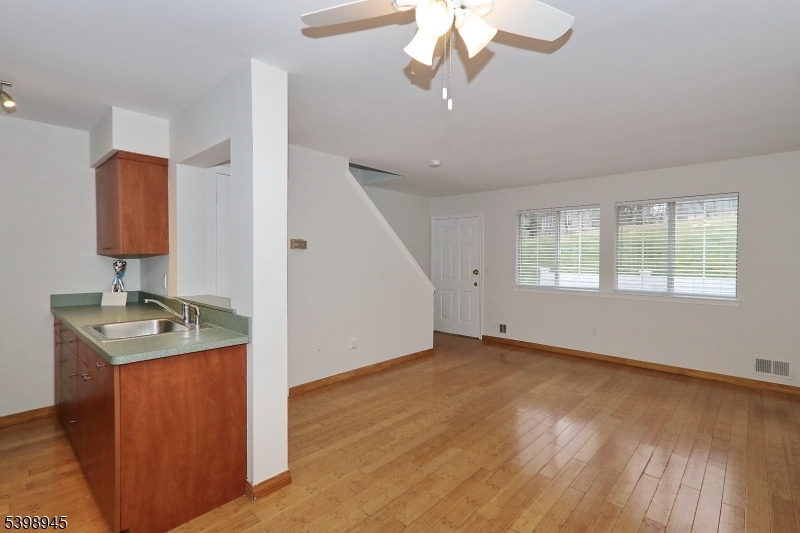 21 Parkside Road Bedminster, NJ 07921 - Photo 16 of 17 wooden floor in an empty room with a window